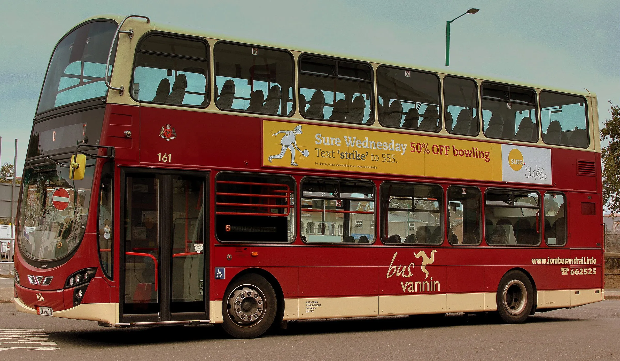 A red and cream Bus Vannin double-decker, fleet number 161, parked side-on at Ramsey bus station