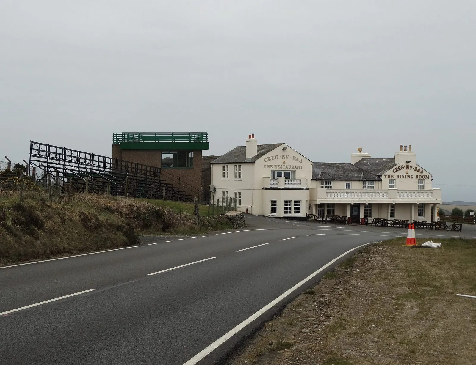The Creg-ny-Baa pub and grandstand beside a sweeping left-hand bend on the TT course