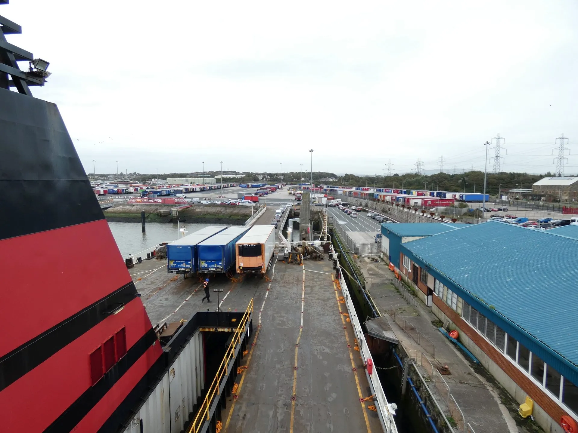 Looking down from Ben-my-Chree's upper deck at Heysham onto the linkspan and quay, with freight trailers lined up and the port behind