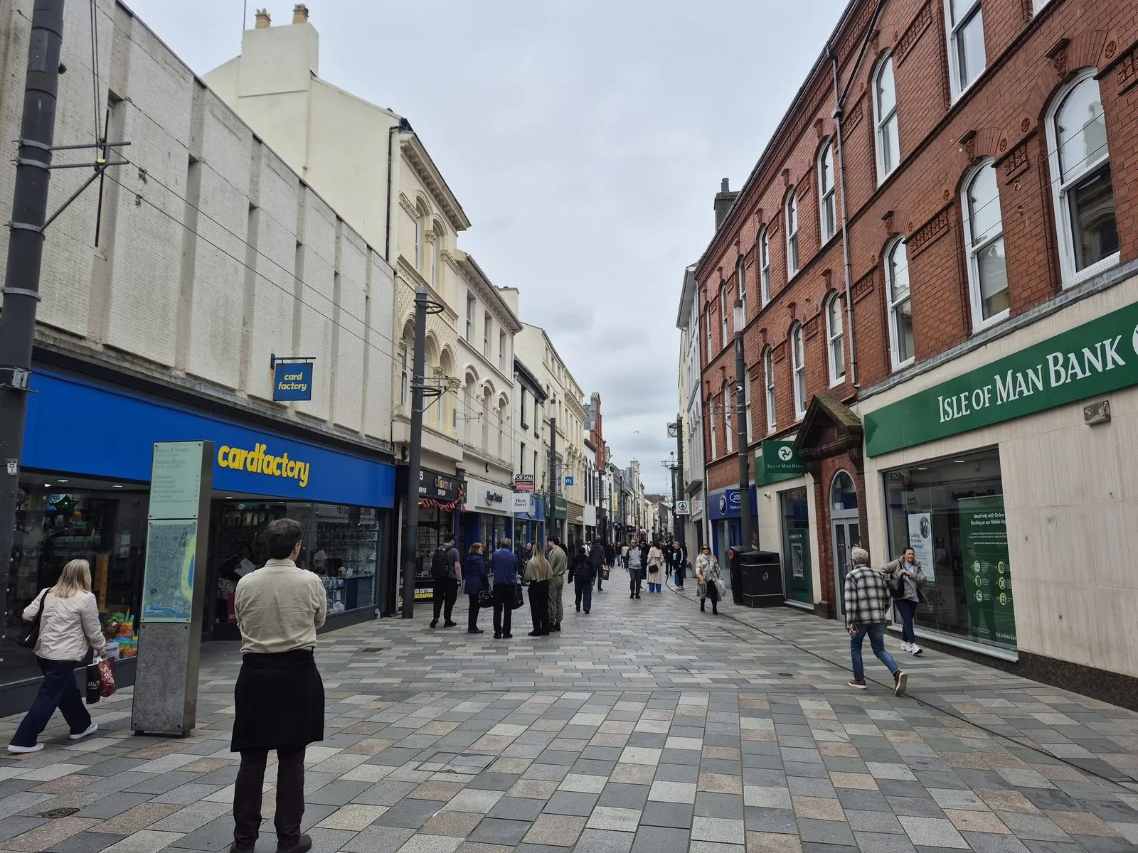 Strand Street in Douglas, a pedestrianised shopping street, with an Isle of Man Bank branch on the right