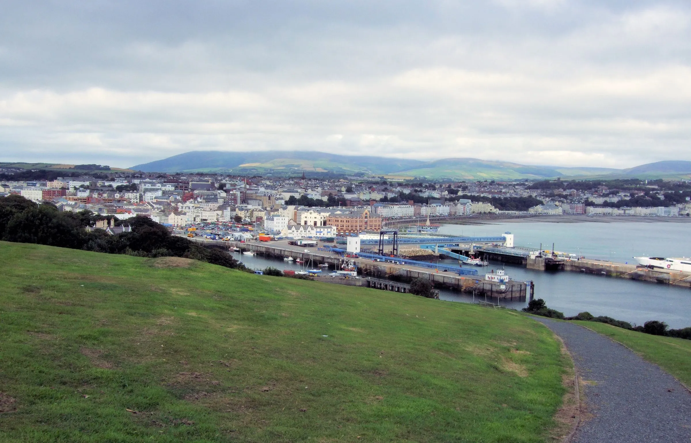Douglas harbour, the Sea Terminal and the town spread round the bay, with the island's hills behind, seen from Douglas Head