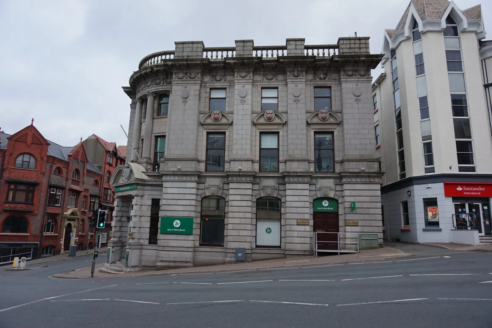 Isle of Man Bank’s grey stone headquarters on the corner of Prospect Hill in Douglas, with a Santander International office beside it