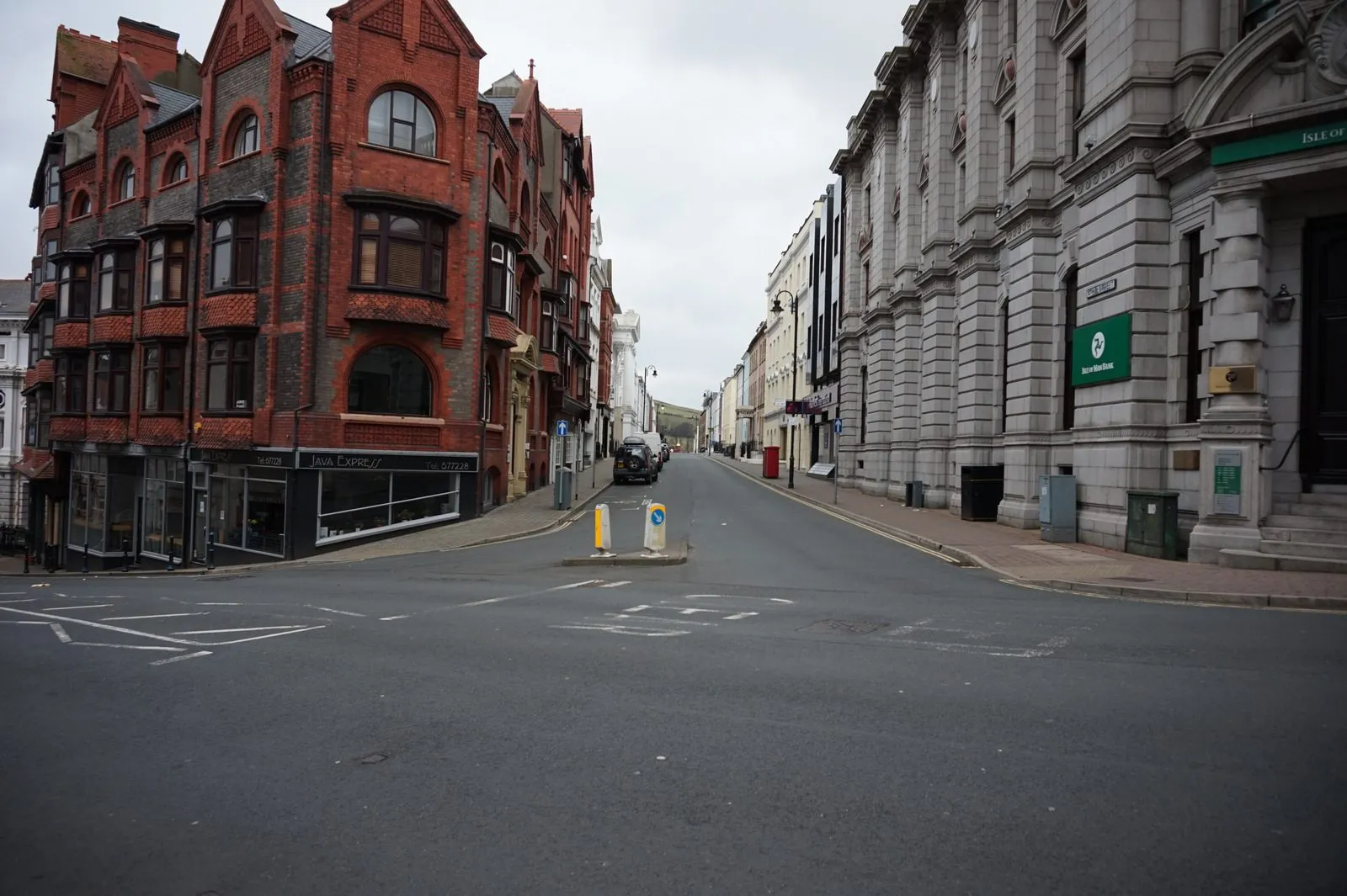 Athol Street in Douglas seen from Prospect Hill, with red-brick and grey stone office buildings either side of the road